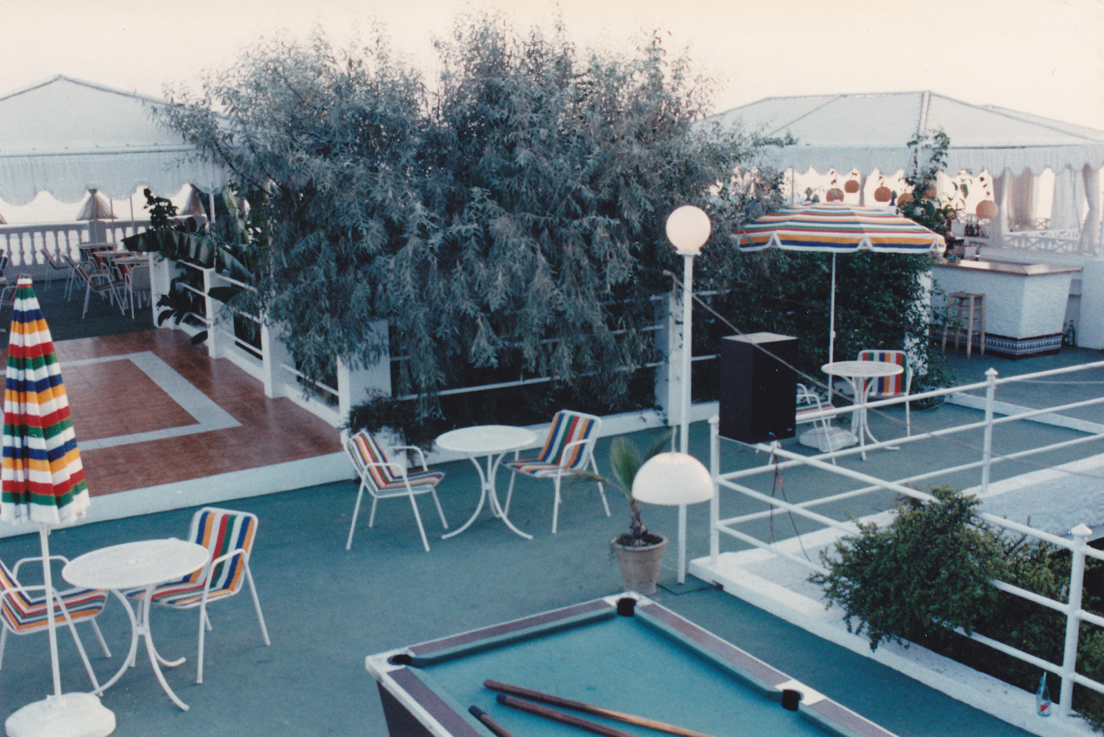 Rooftop terrace with pool table and parasols