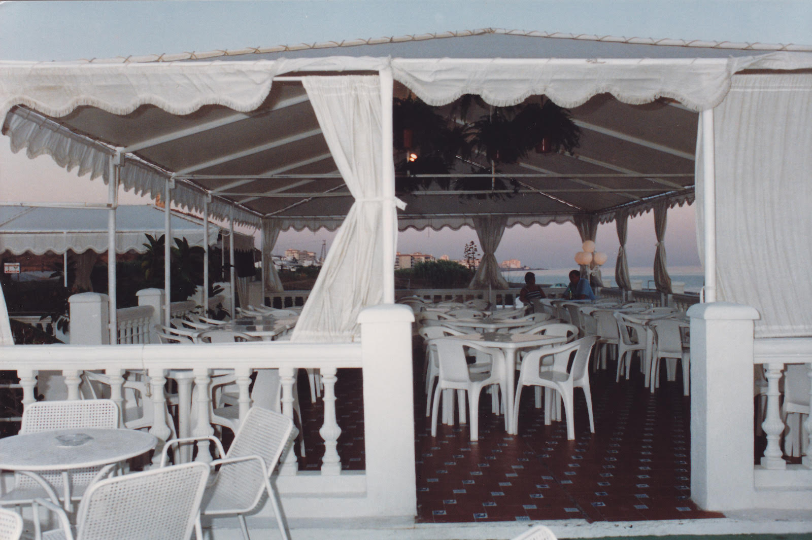 Restaurant terrace at sunset by the sea