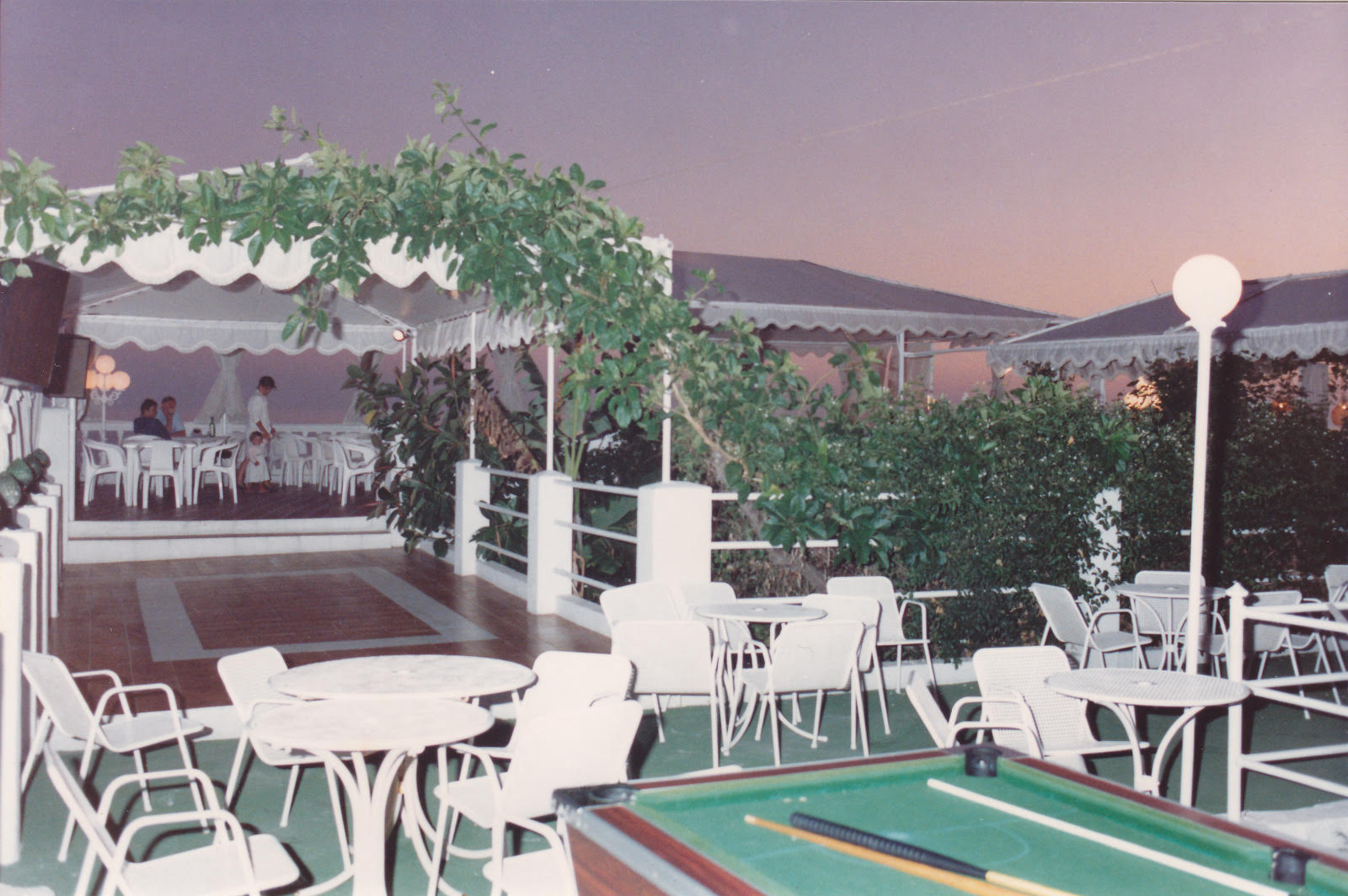 Terrace with pool table at dusk